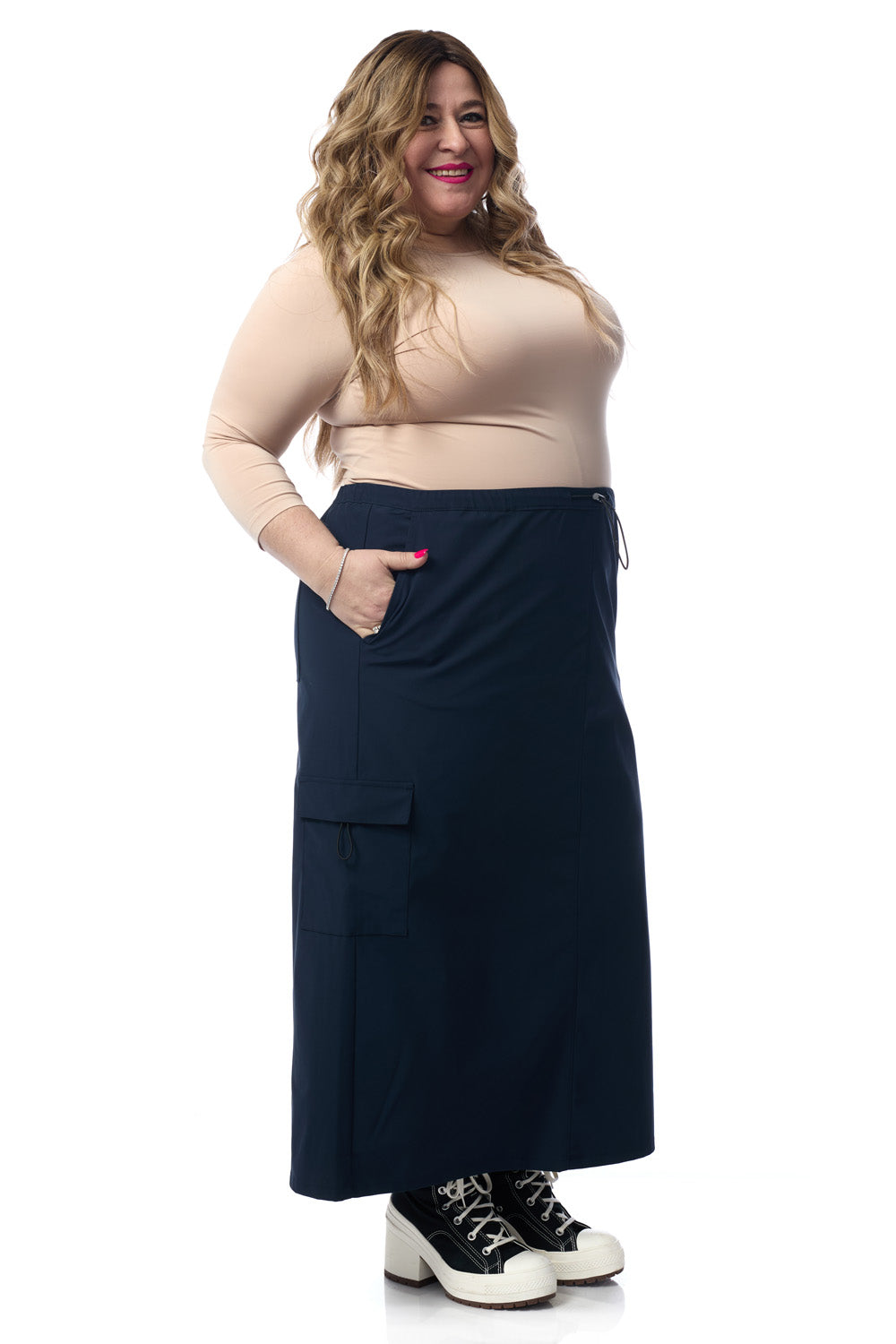 woman wearing navy blue midi length cargo skirt with pockets 