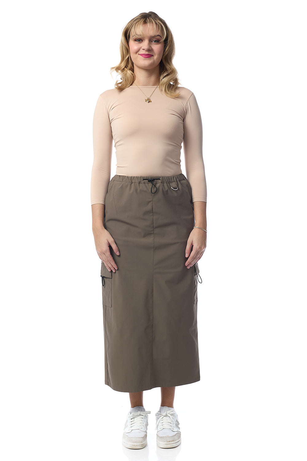 woman wearing fatigue khaki army green colored cargo skirt with pockets 