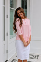 pink 3/4 sleeve henley top with 3 button closure