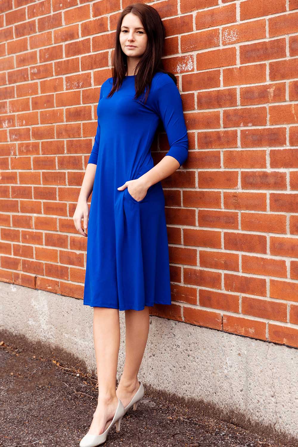 dark blue flary below knee length 3/4 sleeve crew neck modest tznius a-line dress with pockets big enough for smartphone