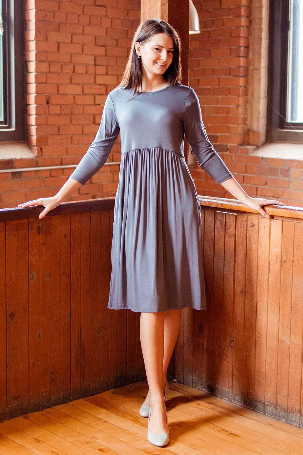 charcoal grey 3/4 sleeve below the knee swing dress with empire waist and side pockets